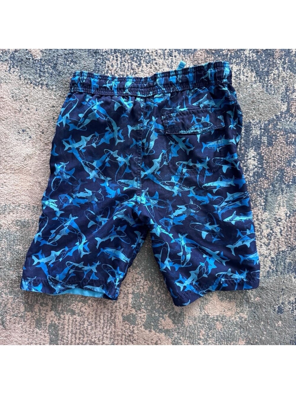 Tommy Bahamas blue shark print swim trunks.  youth size large.